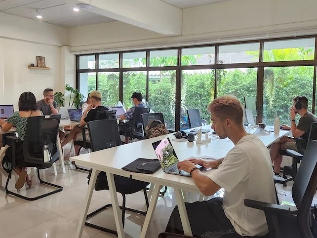 A coworking space with people at desks