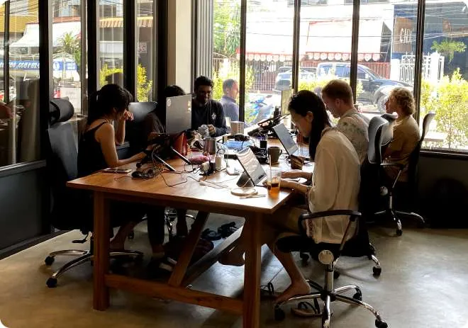 A team working around a long table